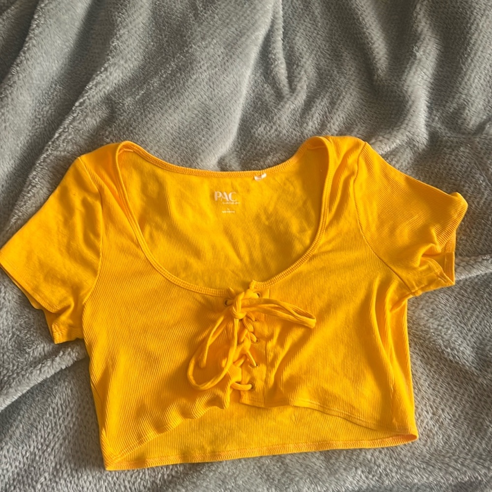 pacsun size small shirt, it is a yellowish orange color. tie front detail.